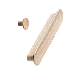 May include: A set of two wooden cabinet knobs in a light wood finish. The knobs are oval shaped and have a smooth, slightly rounded surface.