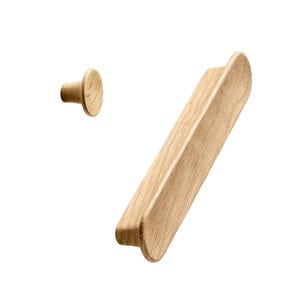 May include: Two wooden cabinet pulls, one is a small knob and the other is a long, rectangular pull. Both are made of light wood with a natural finish.