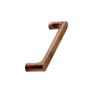 May include: A dark brown wooden cabinet pull with a curved design.