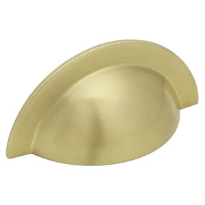 May include: A single, solid brass-coloured cabinet pull with a cup-shaped design. The hardware has a brushed finish and a curved, ergonomic shape. Suitable for drawers and cabinets.