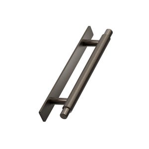 May include: A dark grey door pull featuring a textured, cylindrical handle and a flat, rectangular backplate. The handle has a diamond pattern for grip. This modern hardware is suitable for cabinets, drawers, or doors.