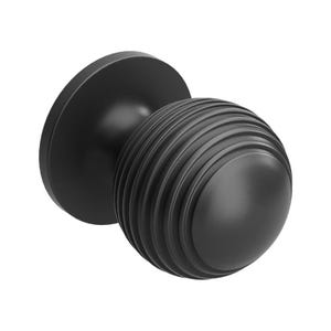 May include: A black door knob featuring a spherical, grooved handle and a circular base. The handle is adorned with horizontal ridges, and the base is flat. The knob is crafted from a matte black material.