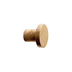 May include: A wooden wall hook with a cylindrical base and a circular head. The hook is made of light-coloured wood, showcasing the natural grain. The design is simple and modern, suitable for various decor styles.