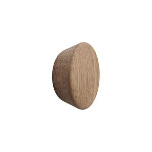 May include: A light brown wooden knob with a rounded, organic shape. The wood grain is visible, adding texture to the smooth surface. The knob is designed for furniture or cabinetry.