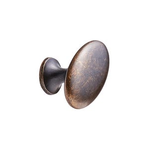 May include: Bronze cabinet knob with an oval handle and a dark, aged finish. The knob has a rounded base and a slightly textured surface, suggesting a vintage style. Suitable for adding a touch of classic elegance to furniture.