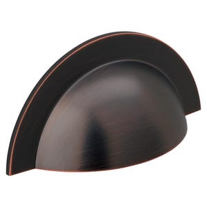 May include: A bronze-coloured cup pull cabinet handle with a curved design. The handle has a dark finish with a subtle texture and a contrasting copper-coloured edge. Suitable for kitchen or bathroom cabinets.