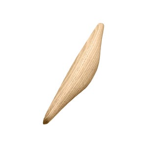 May include: A light wood coat hook shaped like a bird in flight.