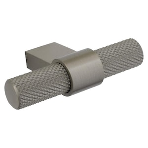 May include: A brushed nickel cabinet pull with a textured, diamond-patterned grip. The pull has a rectangular base and a cylindrical handle, connected by a smooth, circular band. The hardware is designed for easy installation and adds a modern touch.
