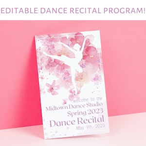 May include: A white silhouette of a ballerina dancing in front of a watercolor background of pink and purple flowers. The text "welcome to the Midtown Dance Studio Spring 2023 Dance Recital May 9th, 2023" is printed below the ballerina.