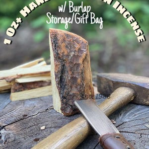 May include: Handcut Piñon incense, with burlap storage/gift bag. A rustic image of a piece of piñon wood, a chisel, and a mallet on a weathered wooden surface. The text "1 oz+ Handcut Piñon Incense" is arched above the wood.