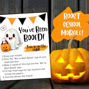 May include: A printable sign with a cartoon ghost holding a pumpkin bucket. The sign says "You've Been Booed! Join in on the Fun!" and includes instructions for a classroom "Booed" activity. The sign is next to a carved pumpkin with a lit candle inside. The text "Boost School Morale!" is written on a bright orange background.