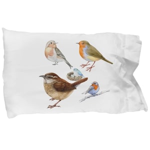 May include: A white pillowcase with a colorful illustration of five birds. The birds are a brown wren, a robin, a bluebird, and two other birds with brown and white feathers. The bluebird is sitting in a nest with a single egg.