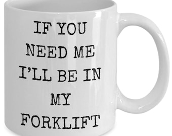 May include: White ceramic coffee mug with black text that reads "If you need me I'll be in my forklift".