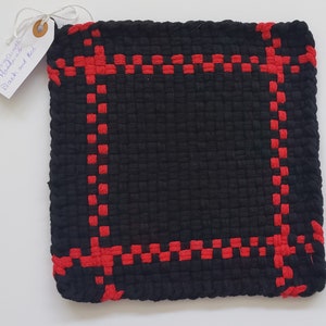 Black solid with red border potholder