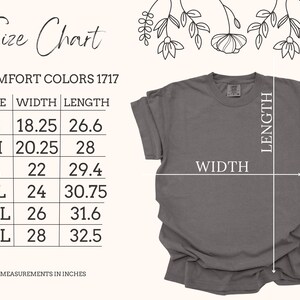 May include: A gray Comfort Colors 1717 t-shirt with a size chart. The chart shows measurements in inches for sizes S to 3XL. The shirt's width ranges from 18.25 to 28 inches, and the length from 26.6 to 32.5 inches.