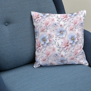May include: A blue armchair with a white throw pillow featuring a floral pattern with pink and blue flowers.