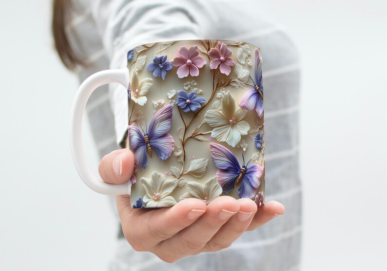 May include: White ceramic mug with a floral design featuring pink, purple, and blue butterflies and flowers.