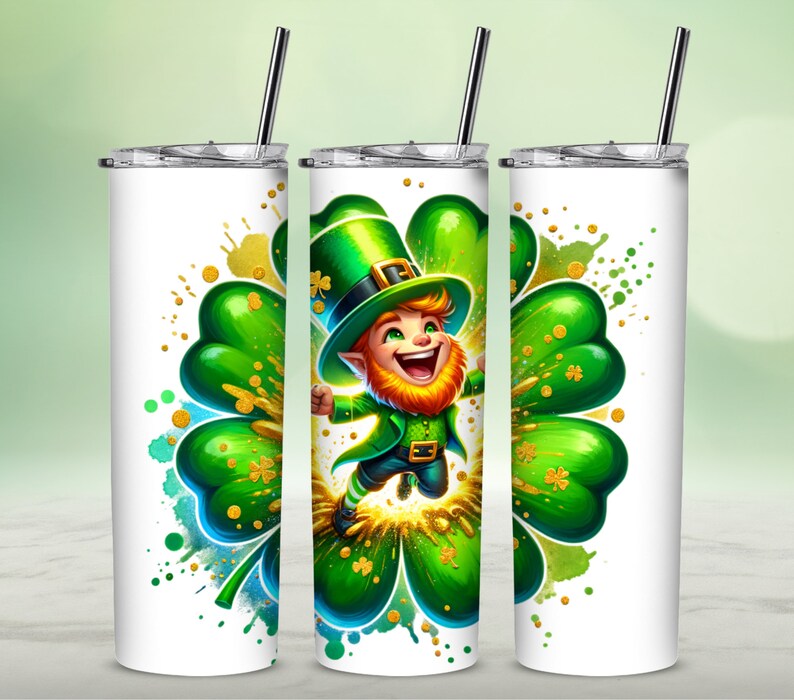 May include: A white stainless steel tumbler with a green four-leaf clover design. A cartoon leprechaun wearing a green hat and holding a pot of gold is jumping in the center of the clover. The background is a watercolor wash of green, blue, and gold.
