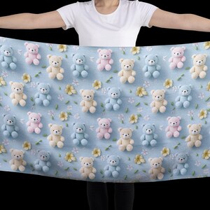 May include: A light blue blanket featuring a repeating pattern of teddy bears in pastel colors: beige, light blue, and pink. Small yellow flowers and green leaves are scattered throughout the design.