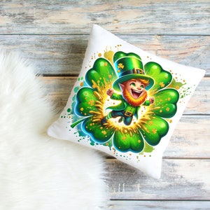 May include: White pillow with a green shamrock and a cartoon leprechaun wearing a green hat and holding a pot of gold. The leprechaun is smiling and has a red beard.