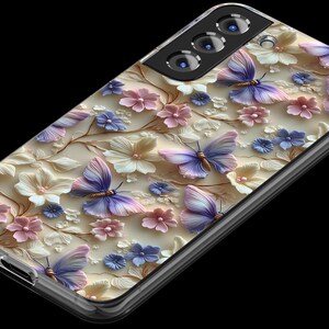 May include: A clear phone case with a floral design featuring butterflies and flowers in shades of pink, purple, and white.