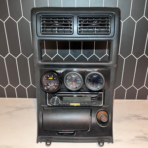 1989-1991 RX7 triple gauge radio adapter.