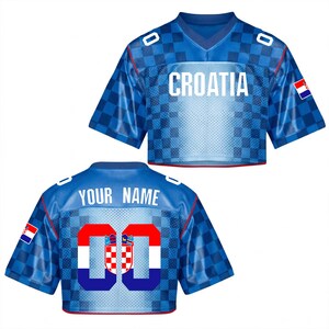 May include: Two blue cropped jerseys with the word "CROATIA" on the front and "YOUR NAME" on the back. The jerseys have a checkered pattern and the Croatian flag on the sleeves. The number "00" is on the back.