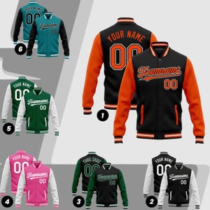 May include: A collection of letterman jackets in various colors, including black, orange, green, pink, and teal. Each jacket features the text "YOUR NAME", "Teamname", and the number "00". The jackets have contrasting sleeves and trim.