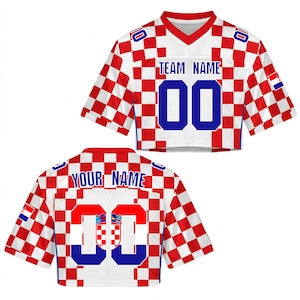 May include: Cropped white and red checkered jersey with blue numbers and text. The jersey features the text "TEAM NAME" and "00" on the front, and "YOUR NAME" and "00" on the back. The Croatian flag is also visible.