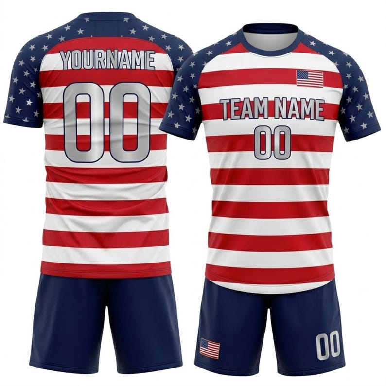 May include: A red and white striped soccer uniform with blue shorts. The jersey has blue sleeves with white stars and the text "YOURNAME" and "TEAM NAME" above the number "00". An American flag is on the jersey.