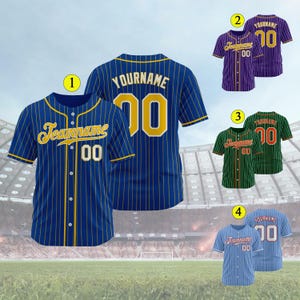 May include: Four baseball jerseys with blue, purple, green, and light blue striped patterns. The jerseys have a gold outline and the text "Teamname" and "Yourname" in a yellow script font. The jerseys have the number "00" on the back.
