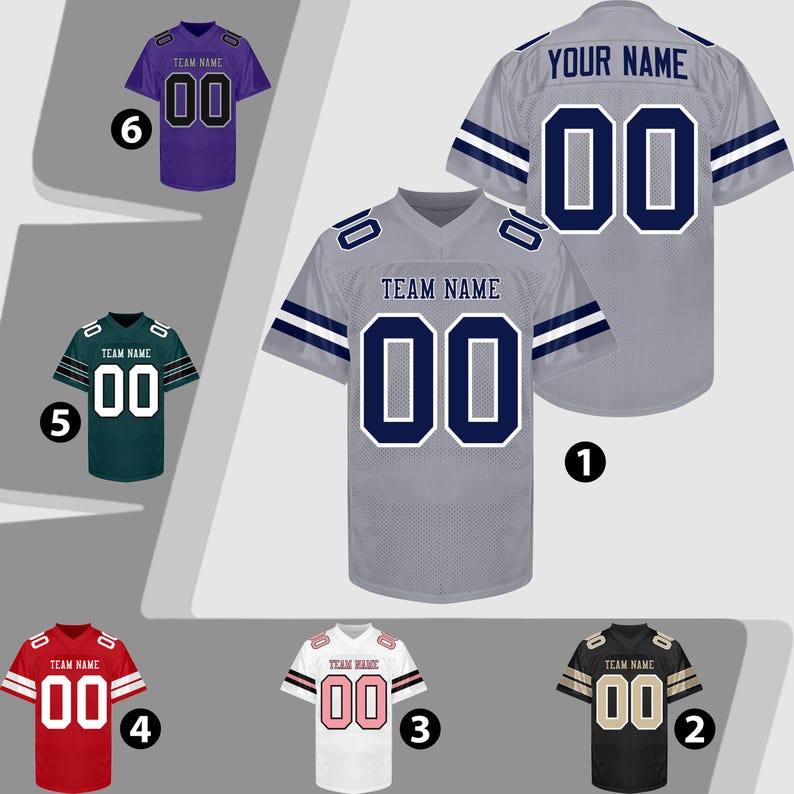 Puede incluir: Seis camisetas de f&uacute;tbol americano en varios colores: gris, negro, rojo, blanco, verde y morado. Cada camiseta tiene el n&uacute;mero "00" y el texto "TEAM NAME" o "YOUR NAME". Las camisetas tienen detalles de color contrastantes en las mangas y los hombros.