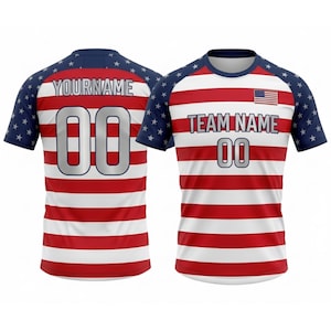 May include: Two short-sleeved jerseys with a red and white striped design. The sleeves are navy blue with white stars. One jersey has the text "YOURNAME" and the number "00" on the back. The other has "TEAM NAME" and the number "00" on the front, with a small American flag.