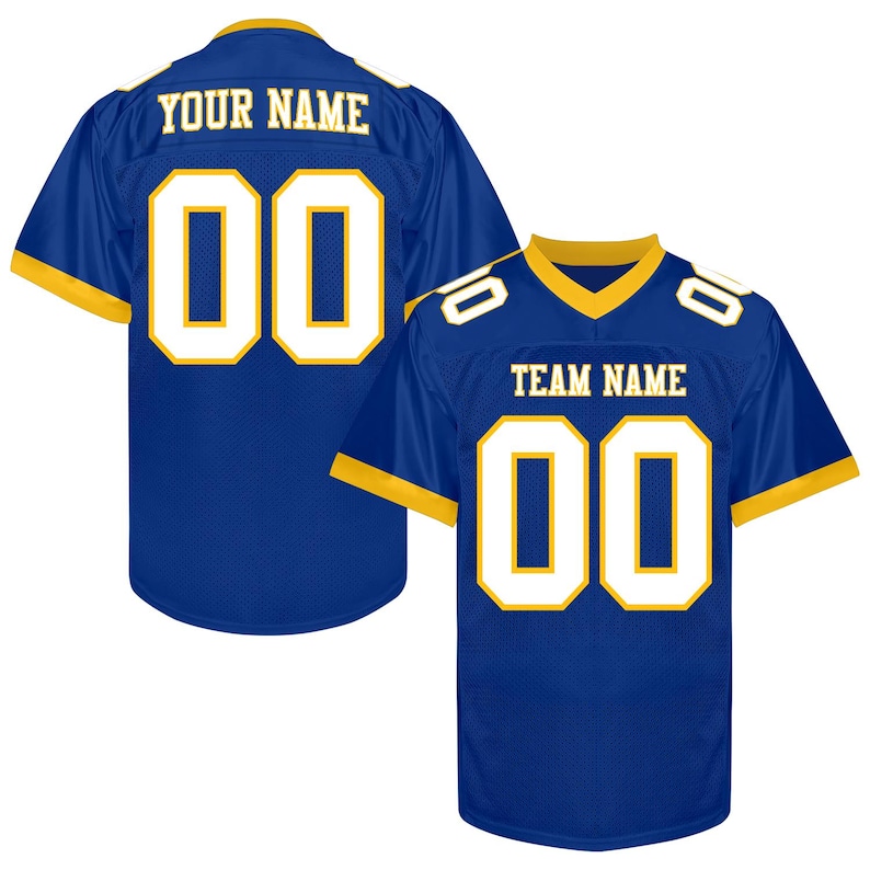 Puede incluir: Dos camisetas de f&uacute;tbol azules con detalles dorados y blancos. Las camisetas muestran el n&uacute;mero "00" en blanco con un contorno dorado. Una camiseta tiene "YOUR NAME" y la otra "TEAM NAME".