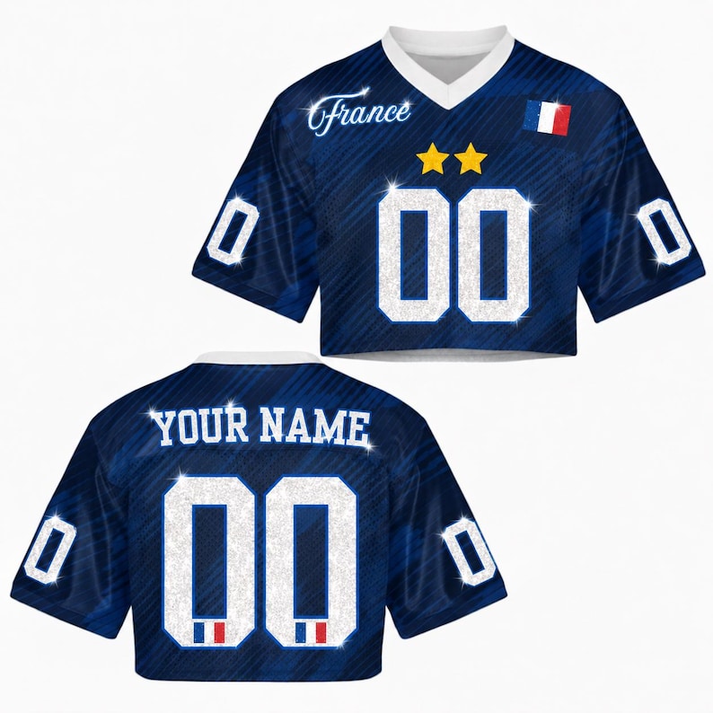 May include: A cropped blue jersey with the word "France" in script and the number "00" in white. The jersey has a white V-neck collar, two gold stars, and a French flag emblem. The back of the jersey says "YOUR NAME" and has the number "00".