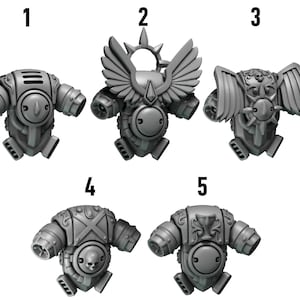 May include: Five gray miniature armor pieces, each with a unique design. The armor pieces have a rounded shape with various details, including vents, circular elements, and decorative wings. The pieces are numbered 1 through 5.