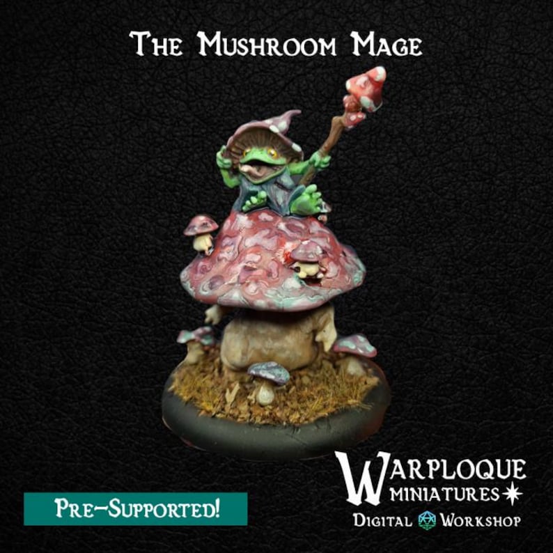 May include: A painted miniature figurine titled The Mushroom Mage, featuring a green frog-like creature wearing a purple hat and holding a mushroom-topped staff, perched atop a large, textured, multi-colored mushroom on a round black base.