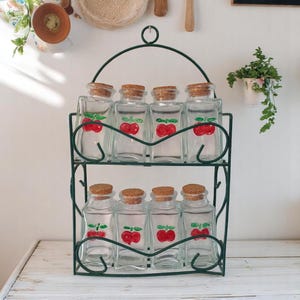 Vintage Green Metal Spice Rack With Eight Thick Glass Spice Bottles With Painted Cherries