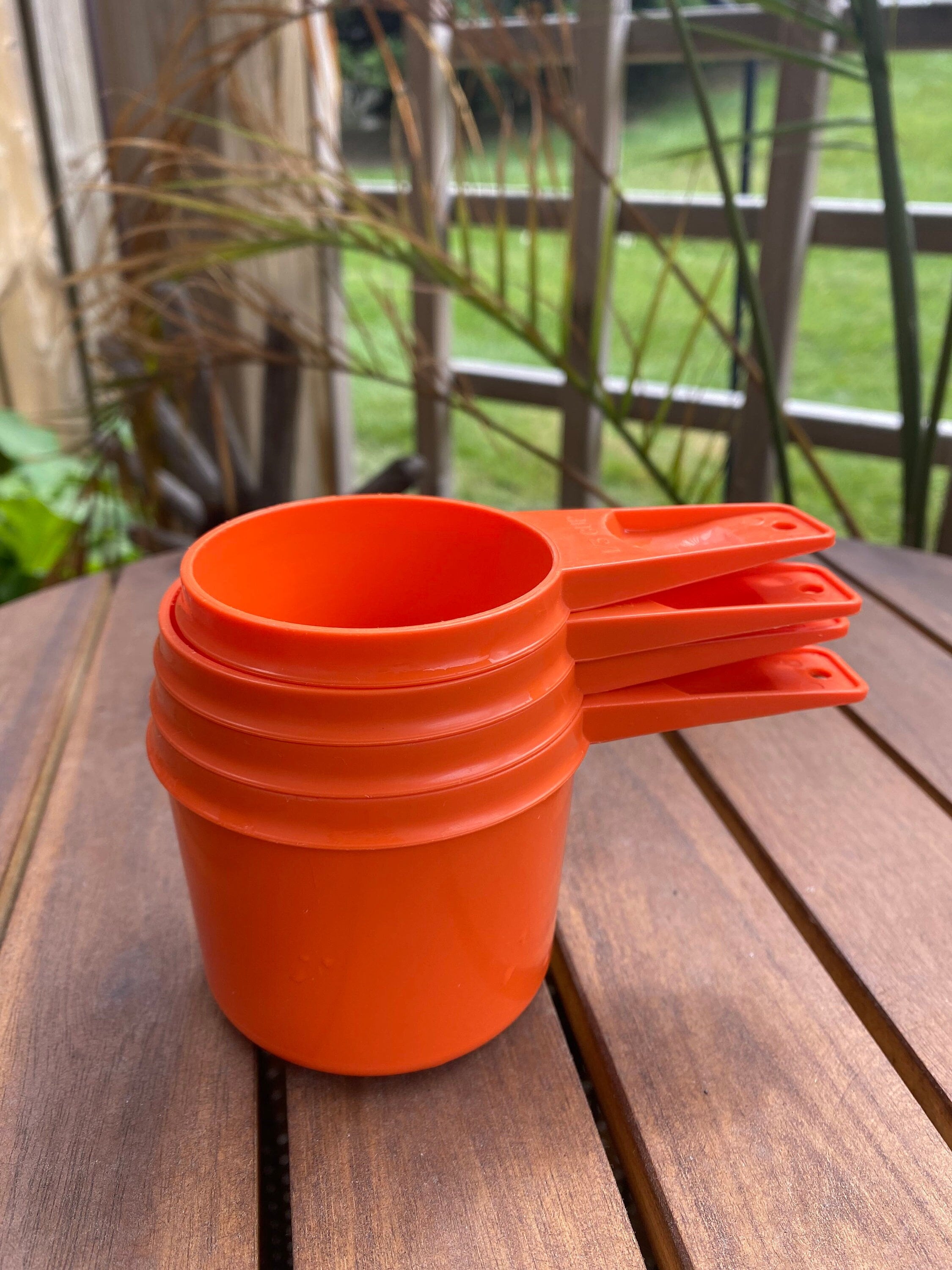 Four Vintage Tupperware Measuring Cups in Green 