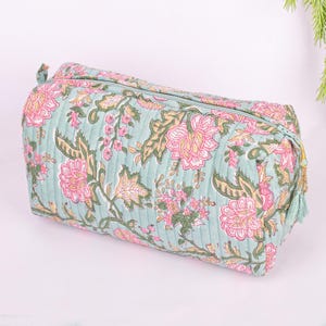 side angle of large quilted bag and shown tassel