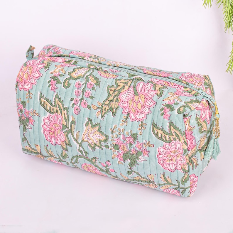 side angle of large quilted bag and shown tassel
