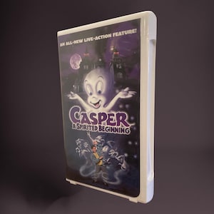 May include: A DVD case for the film "Casper: A Spirited Beginning." The cover shows Casper the ghost with outstretched arms, a haunted castle, and the text "AN ALL-NEW LIVE-ACTION FEATURE!"