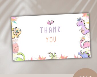 May include: A printable 3.5x5 inch thank you card template featuring a pink, purple, and green dinosaur theme with the text "Thank You" in purple and orange. The text is editable.