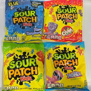 May include: Four packets of Sour Patch Kids sweets in different flavours: Blue Raspberry, Crush Fruit Mix, Tropical, and a green packet with red and orange sweets. Each packet displays the Sour Patch Kids logo and flavour details.