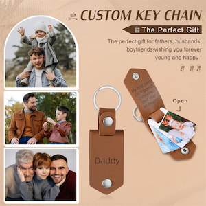May include: A brown leather keychain with a silver key ring and a snap closure. The keychain is engraved with the word "Daddy". The keychain opens to reveal small photo inserts. Text on the keychain reads "My first hero, my biggest blessing, love you so much!"