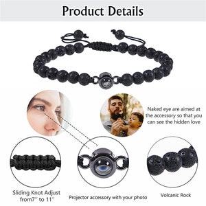 May include: Black lava rock beaded bracelet with a sliding knot closure. The bracelet features a small metal projector charm that reveals a hidden image when viewed from a specific angle. The bracelet is adjustable from 7 to 11 inches.