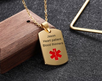 May include: Gold chain necklace with a gold rectangular tag pendant. The tag has the text "Jason Heart patient Blood thinners" and a red medical symbol.