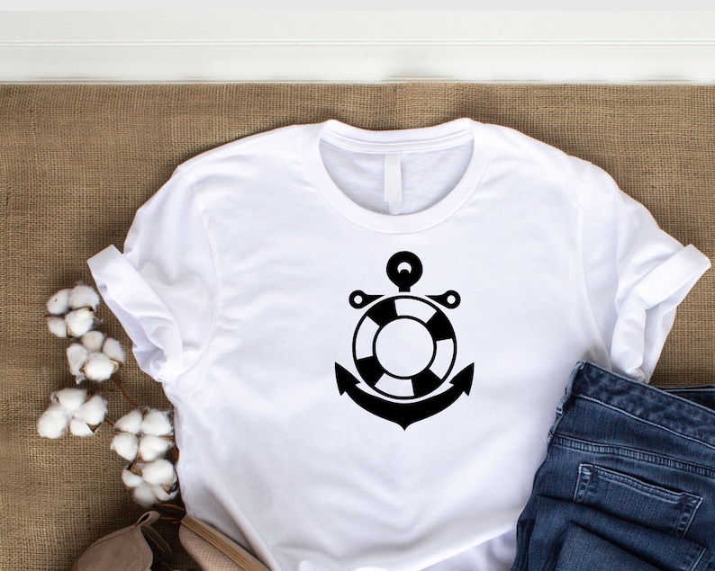 May include: White t-shirt with a black anchor and life preserver design.