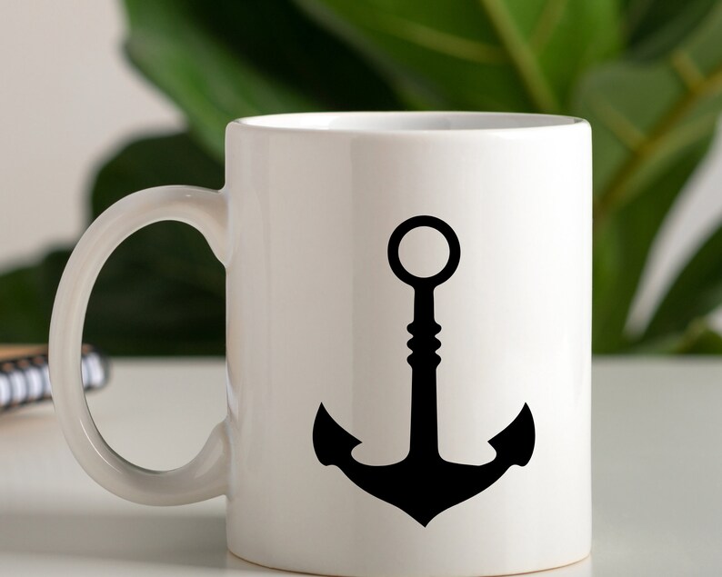 May include: White ceramic mug with a black anchor design. The anchor has a rounded top and a thick base.