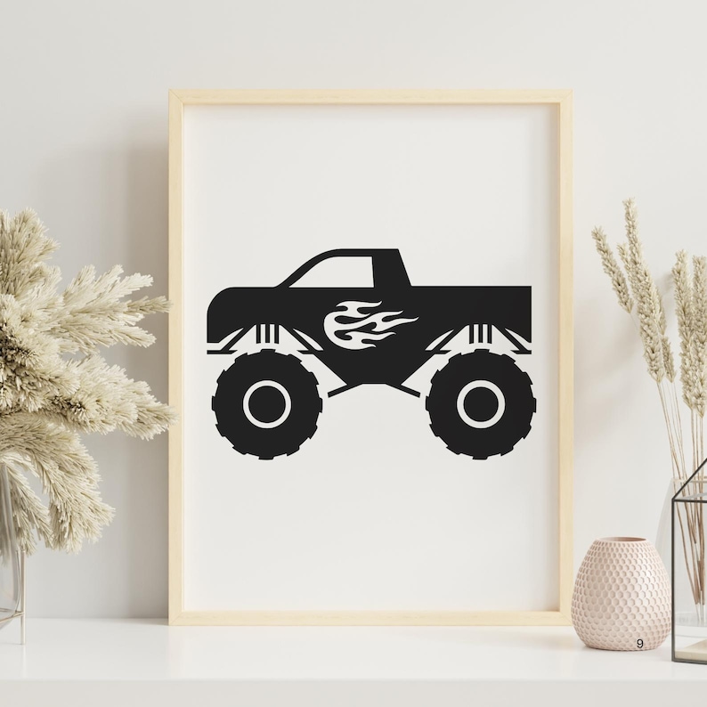 May include: Black and white silhouette of a monster truck with flames on the side. The truck is on a white background.